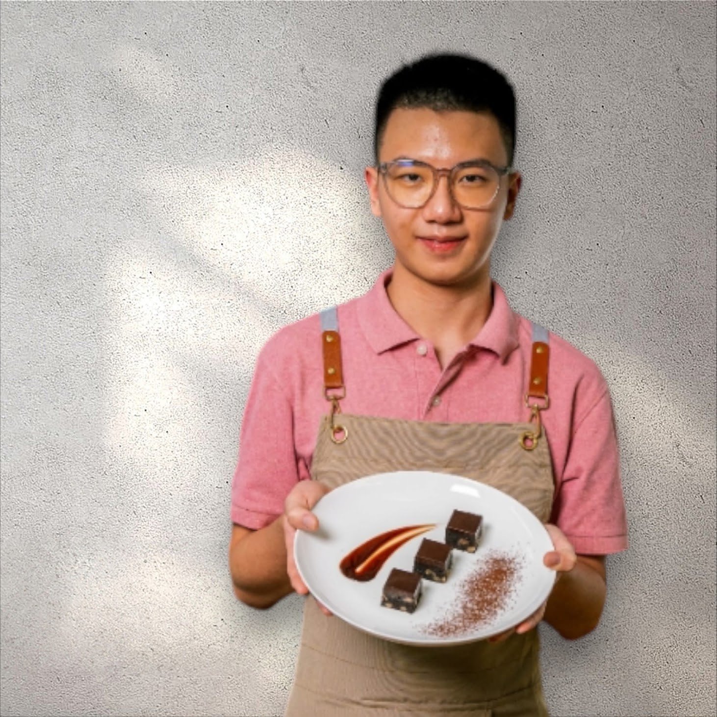 Ben holding a plate of freshly plated chocolate bites